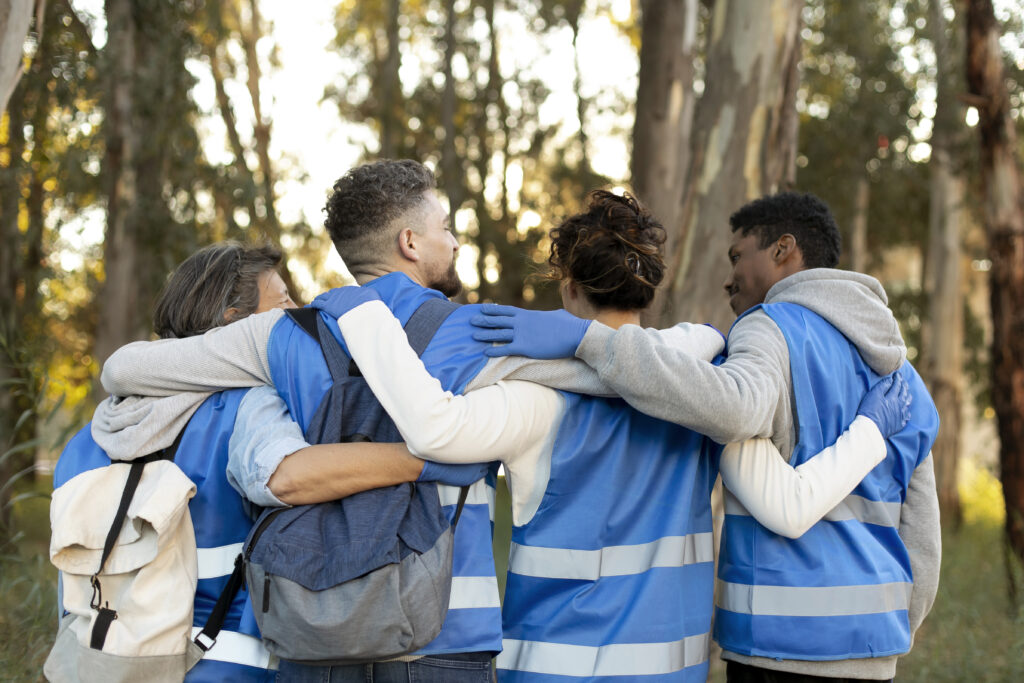 Volunteers with arms around each other