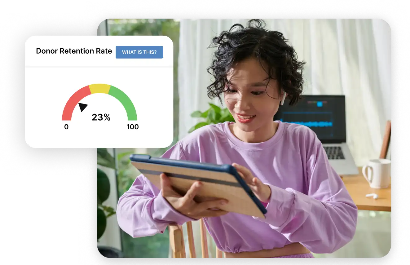 fundraiser looks at a chart showing her donor retention rate